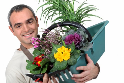 Professional gardeners in West Harrow maintaining a healthy outdoor space
